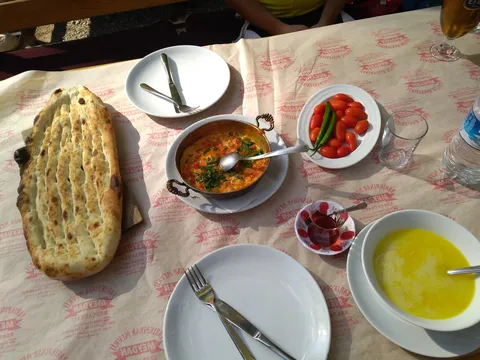 A delicious something for breakfast: Soup and tomatoes with... egg? I forgot.