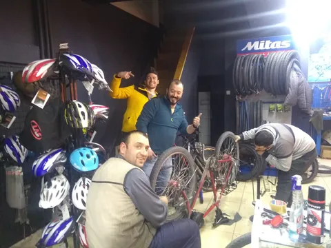 The "Zirve bisiklet" team at work, my CS host Gökhan cheering them on
