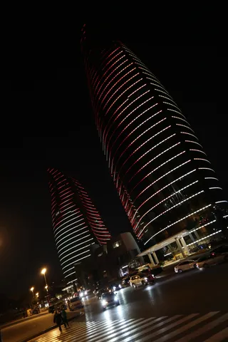 Flame towers flaming around at night
