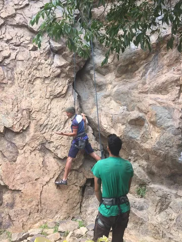 At the wall, complainig to the instructor that this is not a "warm up" route