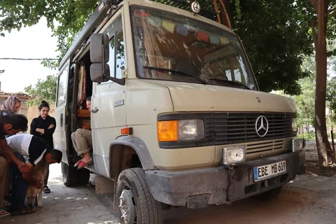 German couple + dog world traveling with their van