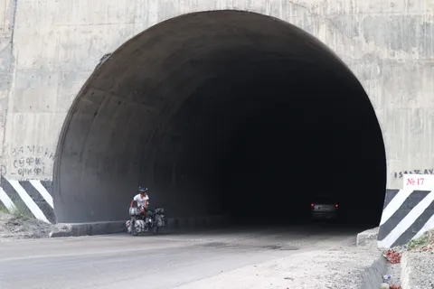 Yoshi emerging from a smaller tunnel