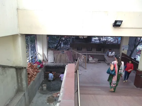 Construction works at a metro overpass. The whole family is at work here