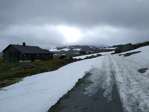 One of a few snow fields to cross. Quite a chore with all the luggage. Reward: wet feet