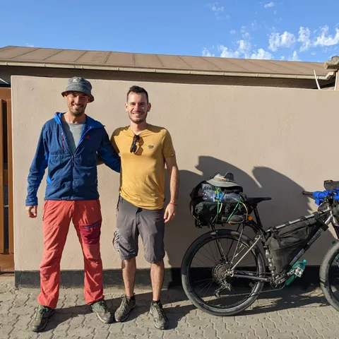 Fellow cyclist Roman leaving Swakop after 6 days of rest thanks to the energy earned from several bottles of wine