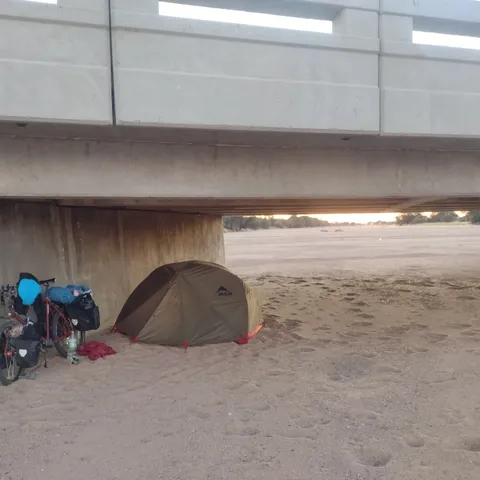 Looks like a tent under a bridge. Weird.